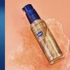 imageVaseline Illuminate Me Shimmering Body Oil Created for Melanin Rich Skin Illuminates Skin with Finishing Touch of Shimmer for Glowing Skin 33 oz33 Fl Oz Pack of 1
